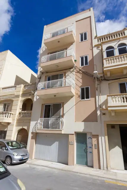 Apartment building exterior on a quiet street